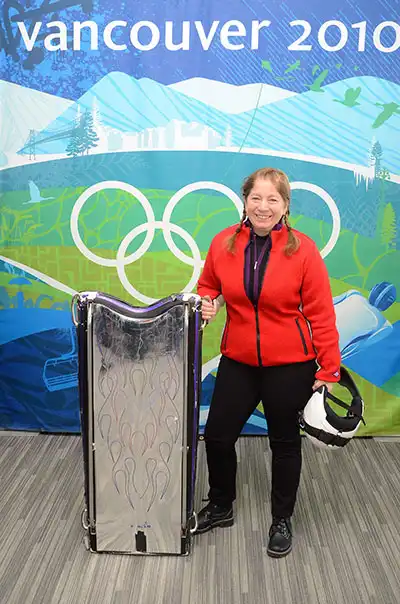 Varian of Port Susan Dental Care at Vancouver 2010 Olympics holding ski gear